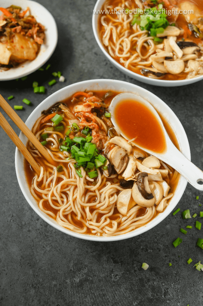 https://thefoodietakesflight.com/wp-content/uploads/2020/10/kimchi-dumpling-noodle-soup-vegan-recipe-2-679x1024.png