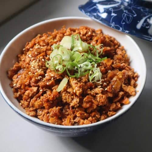 Shredded tofu bulgogi over steamed short grain rice in a ceramic bowl