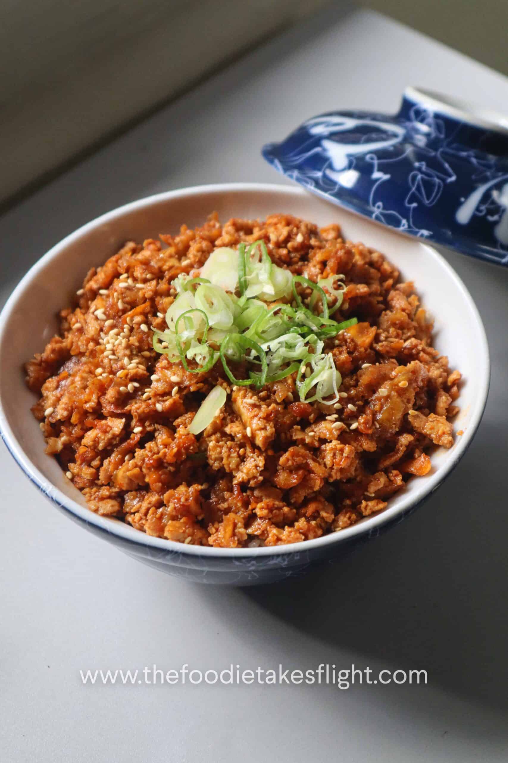 Shredded tofu bulgogi over steamed short grain rice in a ceramic bowl