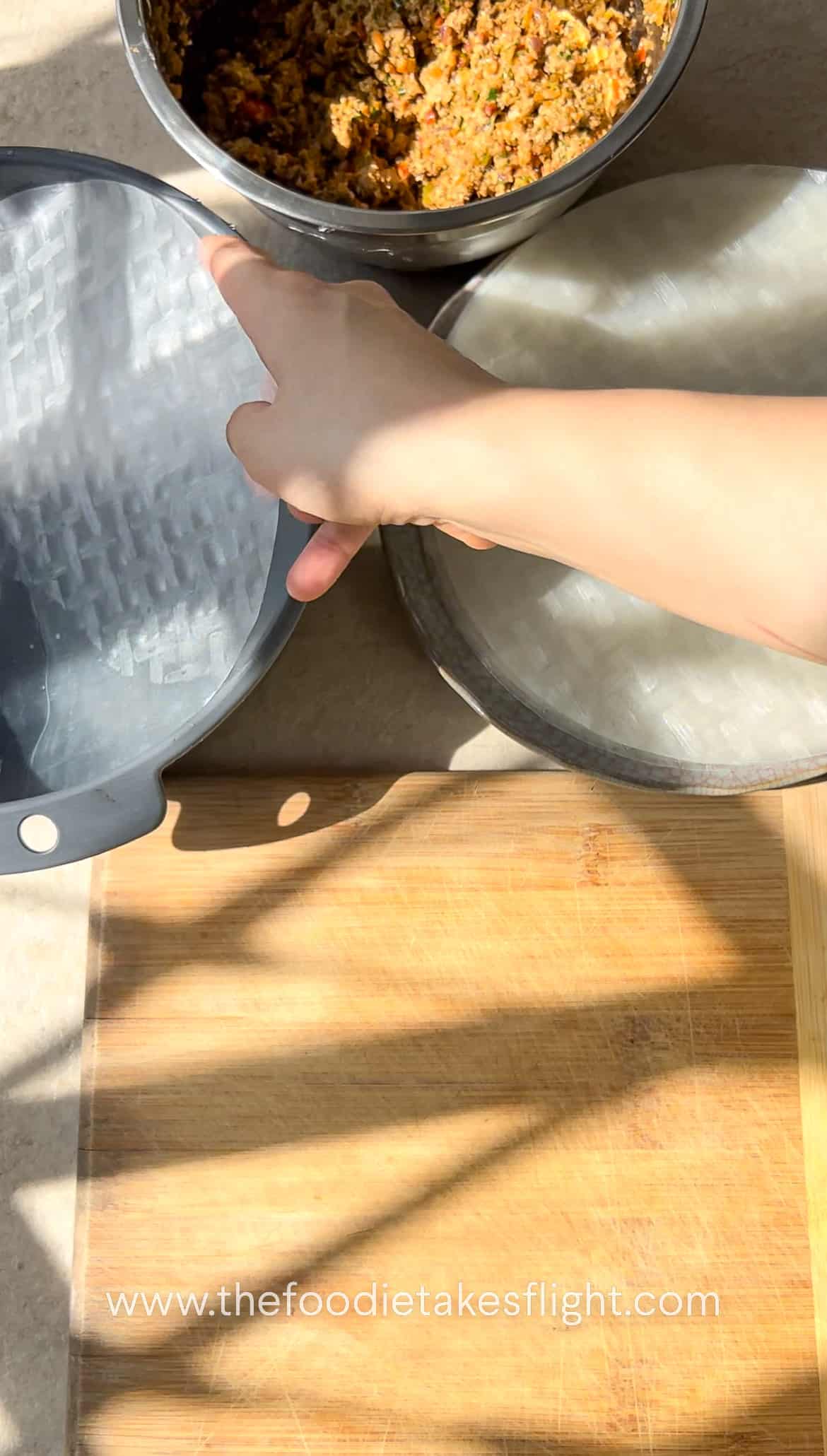 dipping the rice paper in water