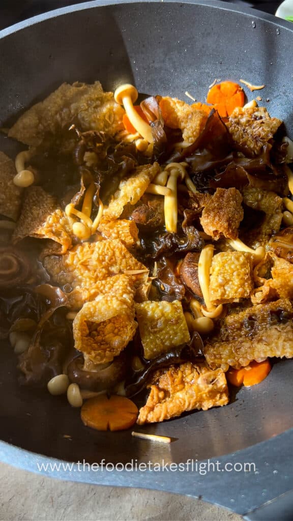 Braising beancurd rolls with mushrooms