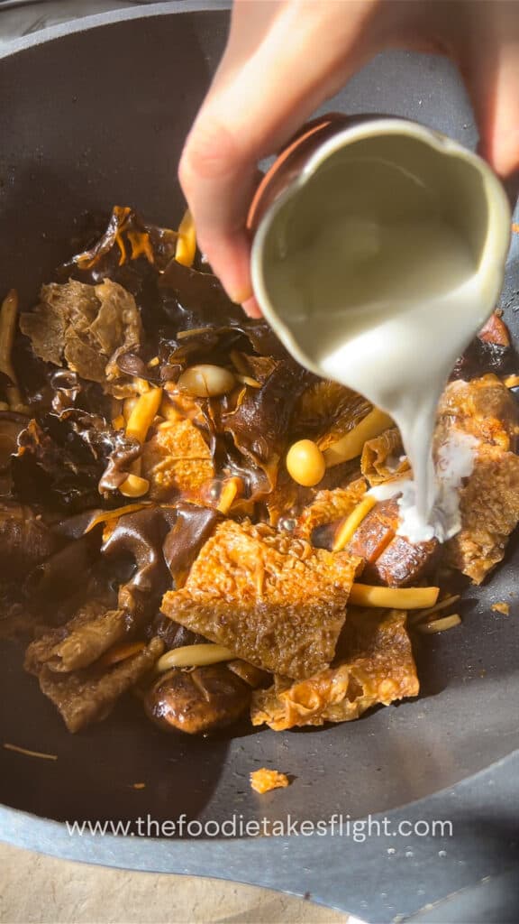 Adding cornstarch slurry to thicken the sauce