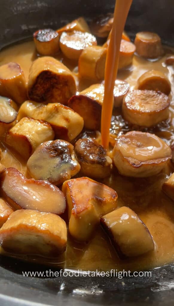 Cooking the Miso Garlic King Oyster Mushrooms in a pan