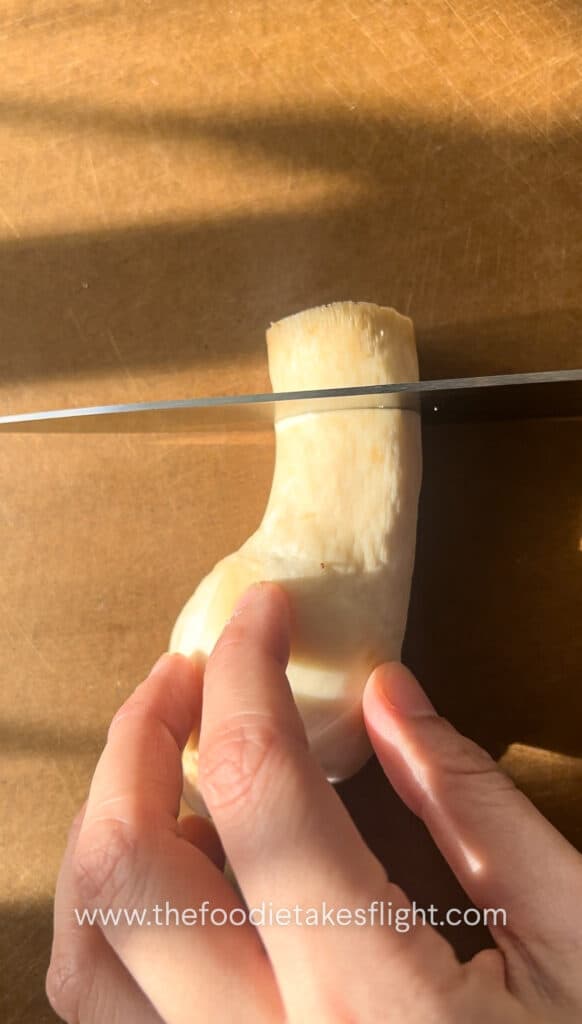 Slicing fresh king oyster mushrooms