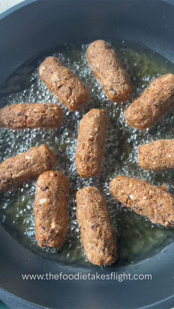 cooking longganisa or filipino sausages