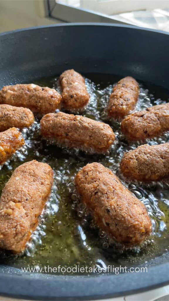 cooking longganisa or filipino sausages