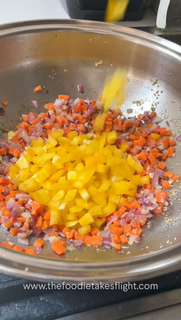 sautéing diced carrot and yellow bell pepper