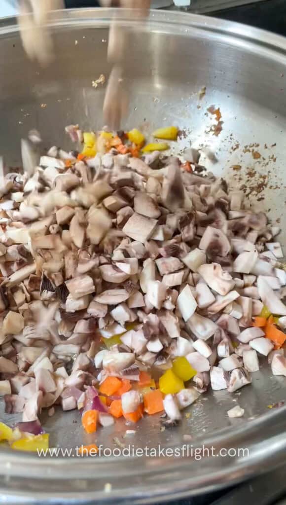 sautéing diced carrot, yellow bell pepper, mushrooms