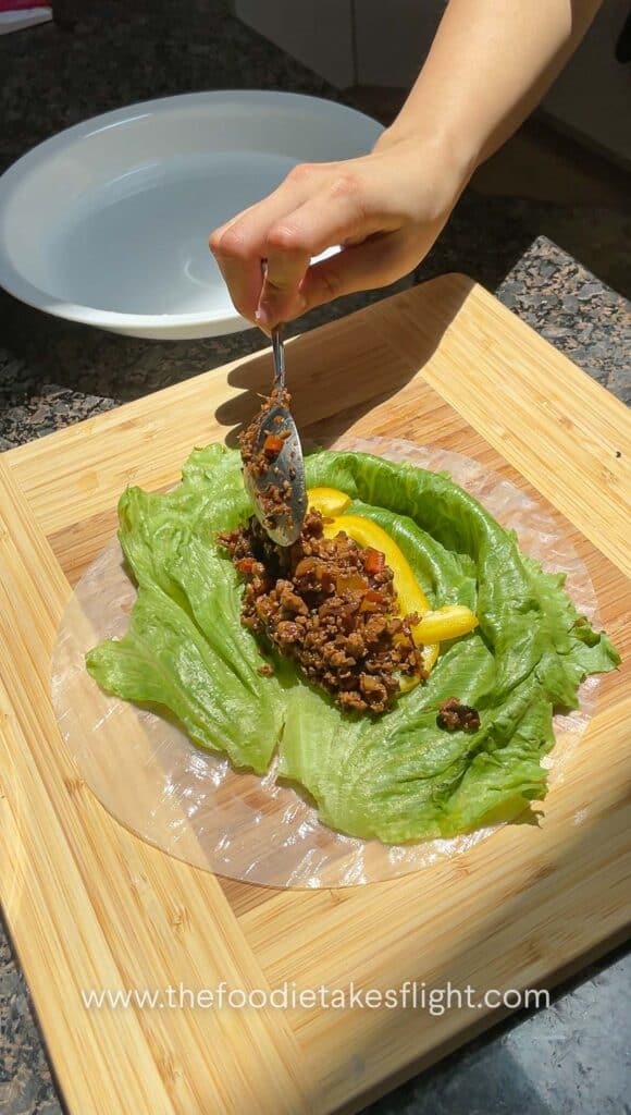 making rice paper rolls with tofu and mushroom filling