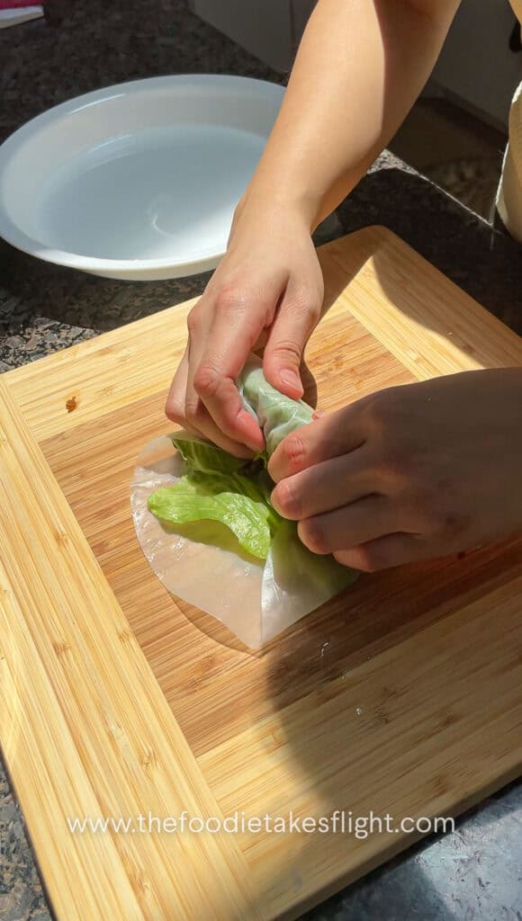 folding rice paper rolls with tofu and mushroom filling