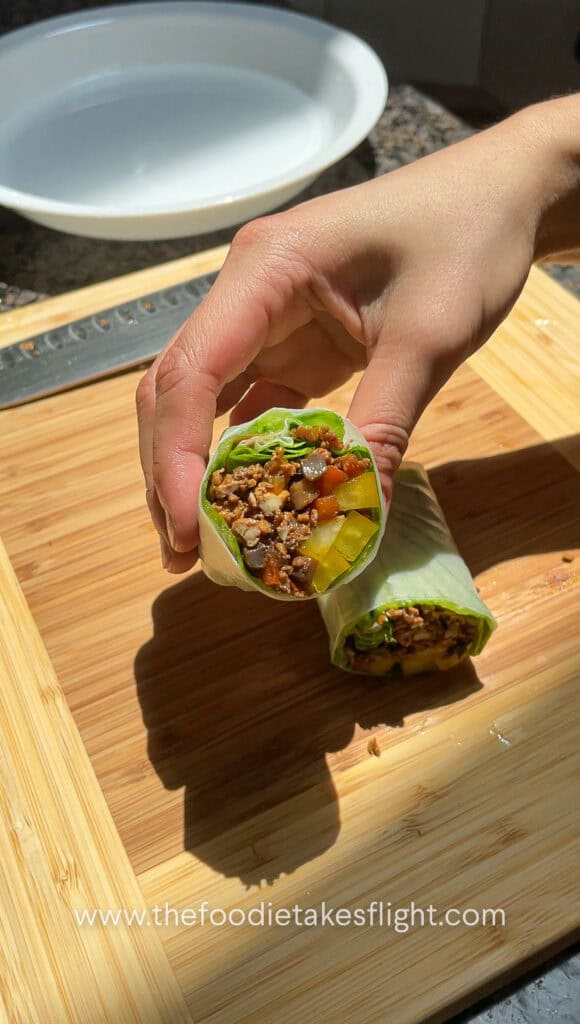 folding rice paper rolls with tofu and mushroom filling
