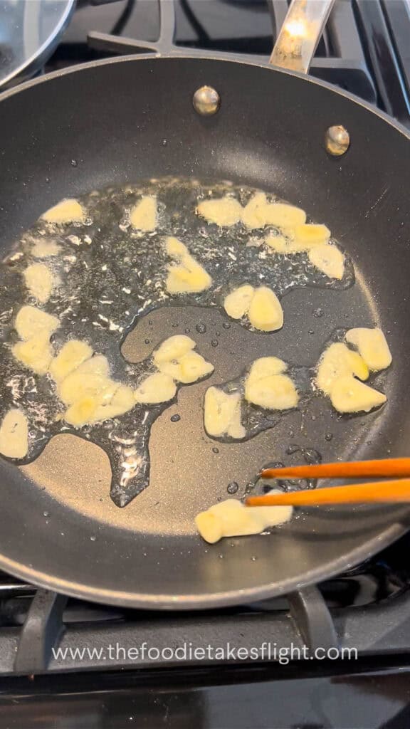 frying thinly sliced garlic