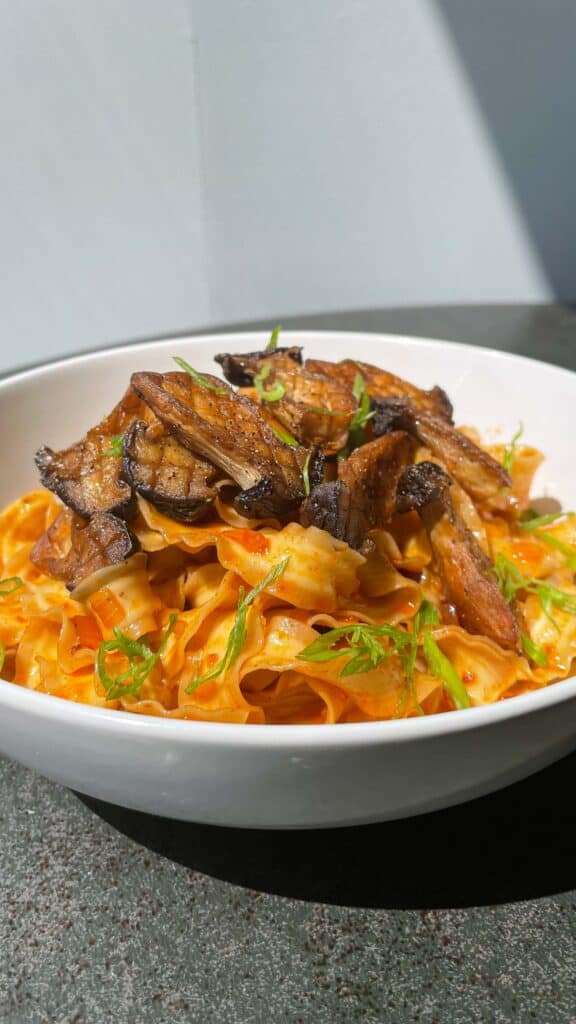 shallot gochujang noodles with pan seared king oyster mushrooms