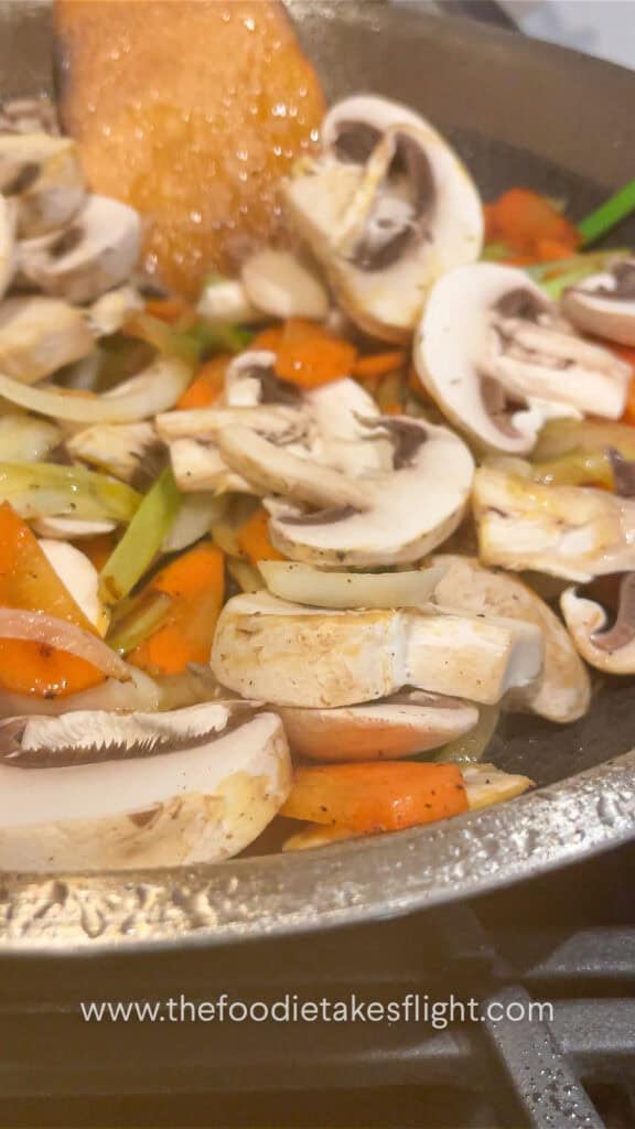 stir-frying the vegetables with tofu