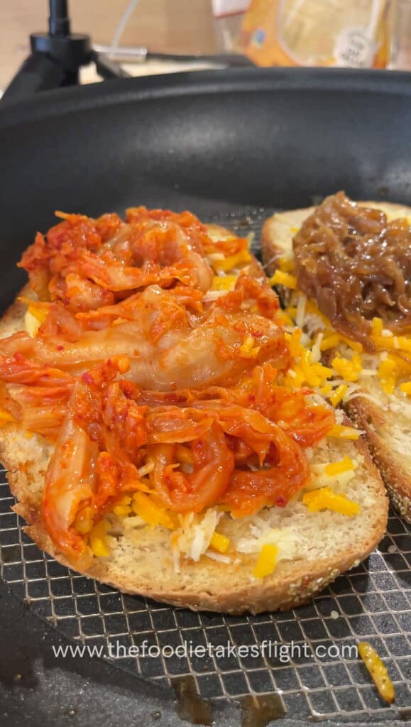 Adding kimchi and caramelized onions