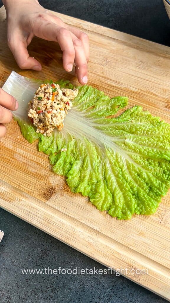 rolling the stuffed cabbage rolls