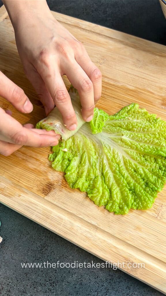 rolling the stuffed cabbage rolls