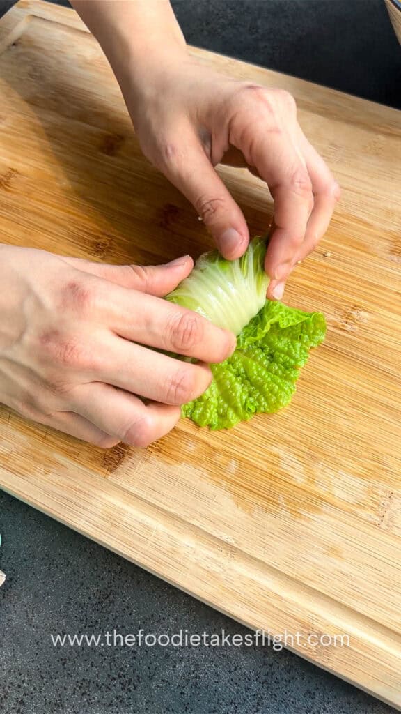 rolling the stuffed cabbage rolls