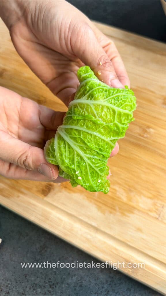 rolling the stuffed cabbage rolls