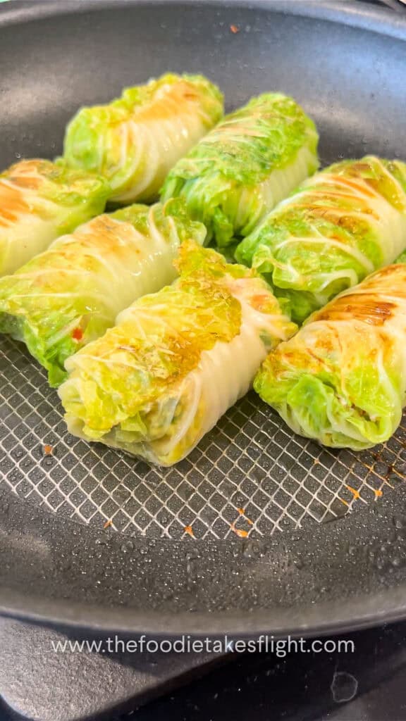 pan frying the cabbage rolls