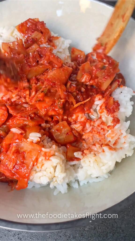 mixing kimchi rice