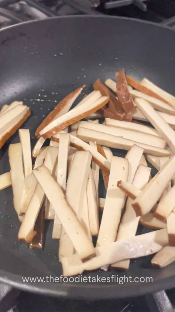 stir-frying smoked tofu strips
