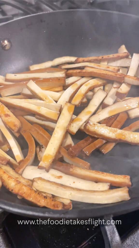 stir-frying smoked tofu strips