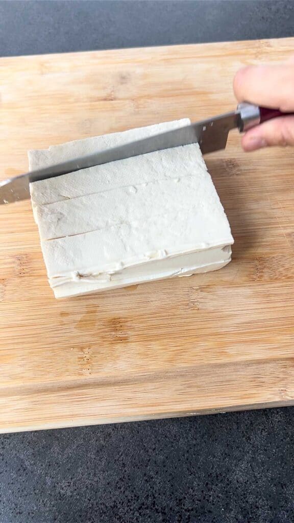 slicing soft tofu for mapo tofu