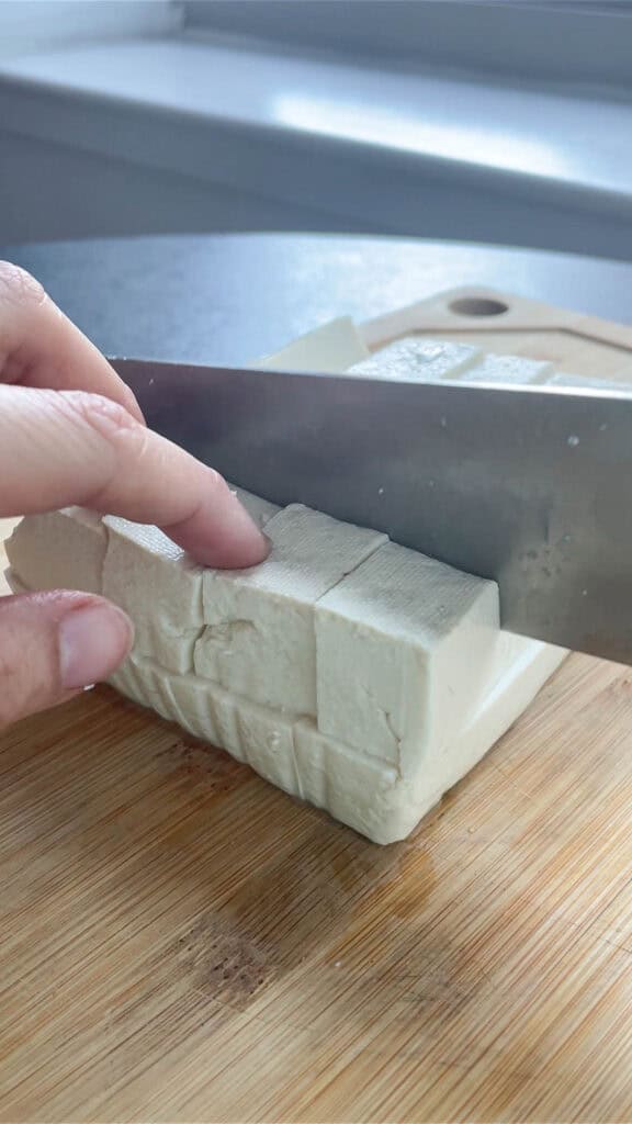 slicing soft tofu for mapo tofu