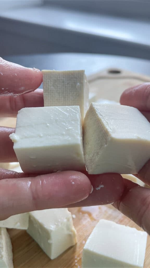 slicing soft tofu for mapo tofu