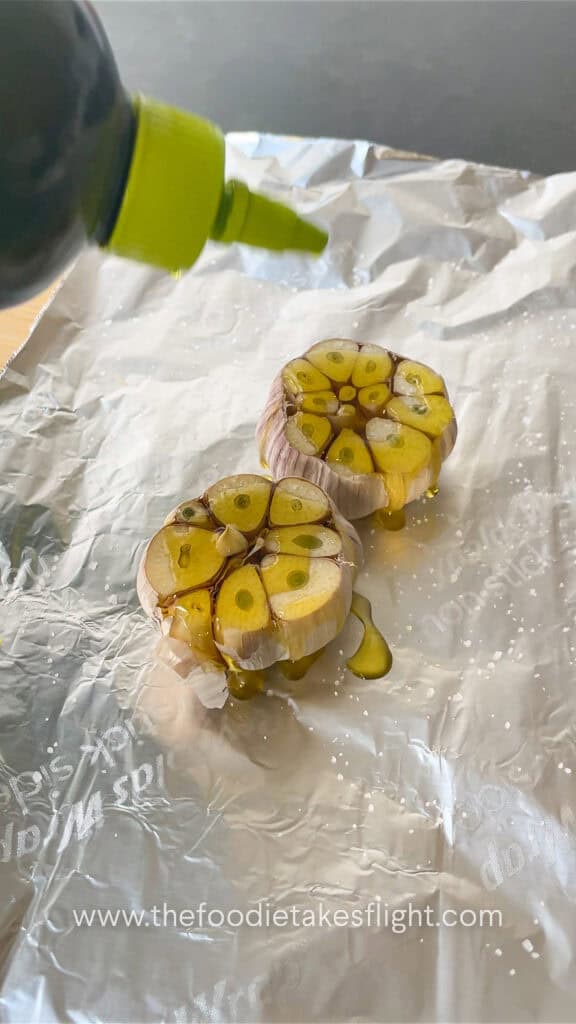 whole heads of garlic with oil