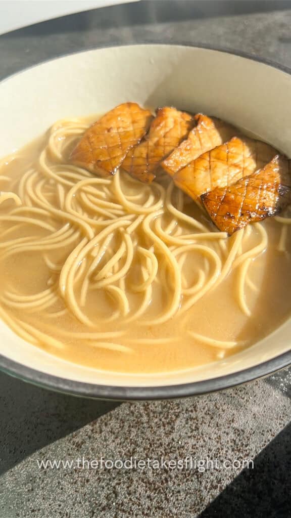 assembling roasted garlic miso noodle soup