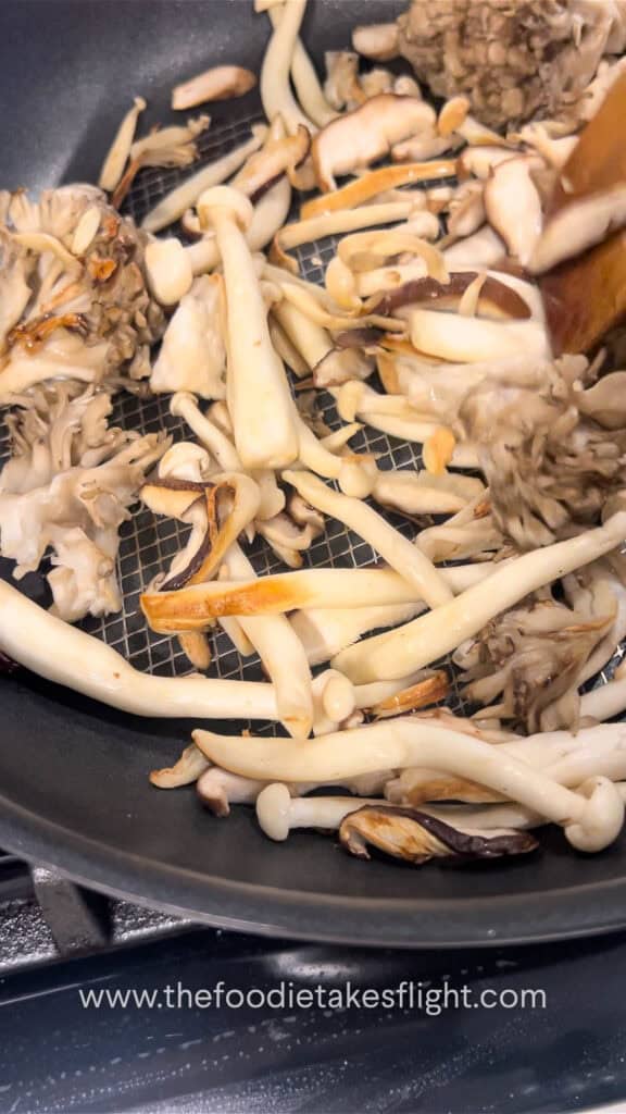 searing mushrooms on a pan