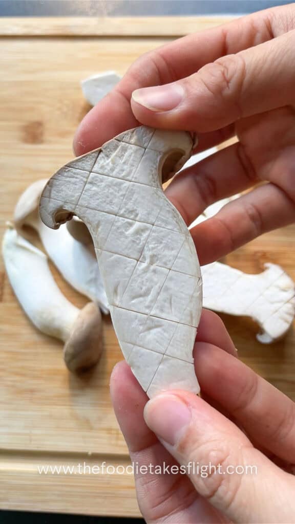 King oyster mushrooms sliced with cross hatch pattern