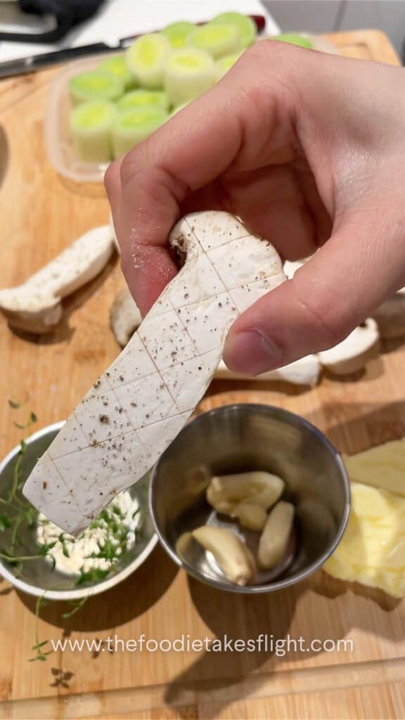 Seasoning mushrooms with salt and pepper