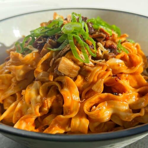 sweet chili tahini noodles in a wok