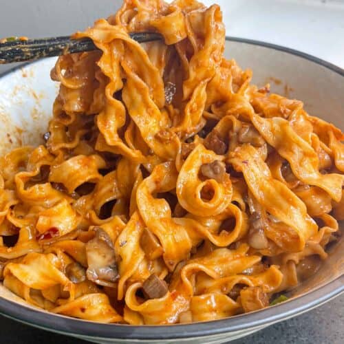 sweet chili tahini noodles in a wok