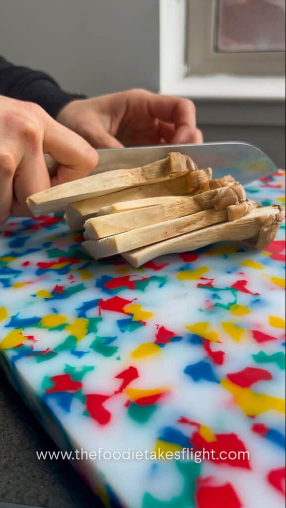 slicing king oyster mushrooms