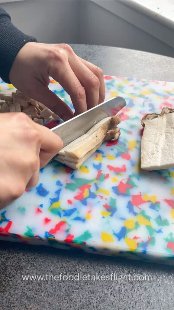 slicing king oyster mushrooms