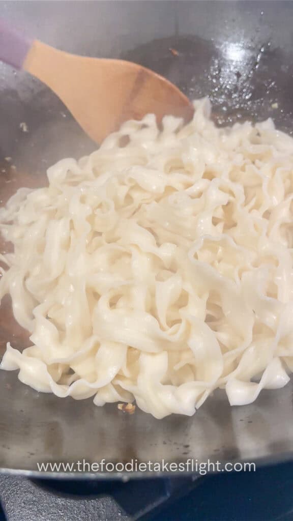 cooking guan miao or knife cut noodles