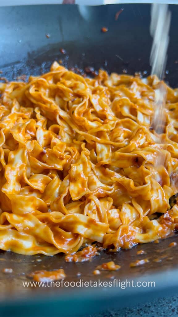 sweet chili tahini noodles in a wok