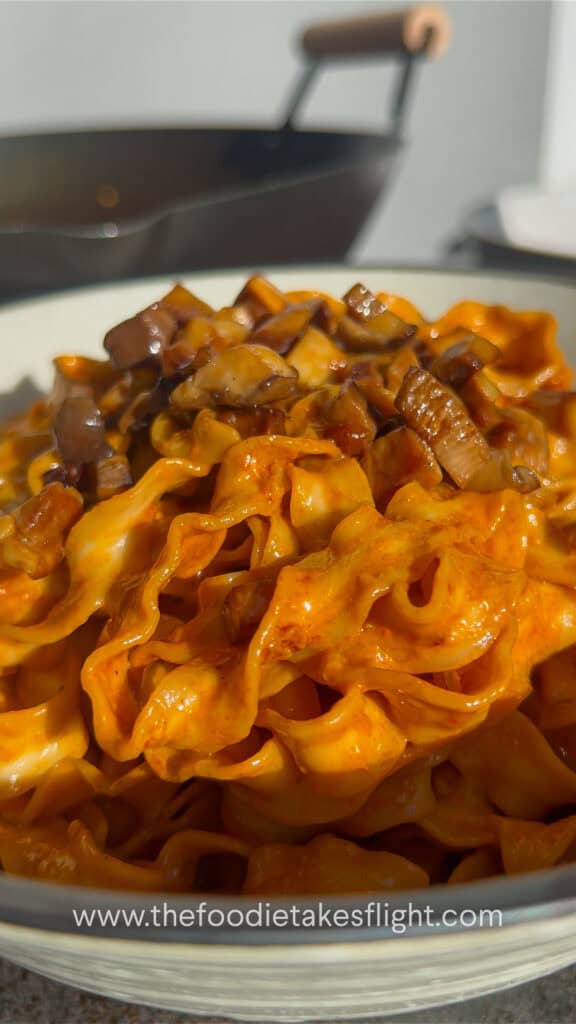 sweet chili tahini noodles in a wok