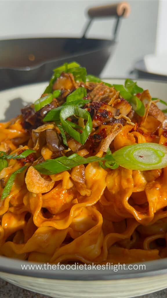 sweet chili tahini noodles in a wok