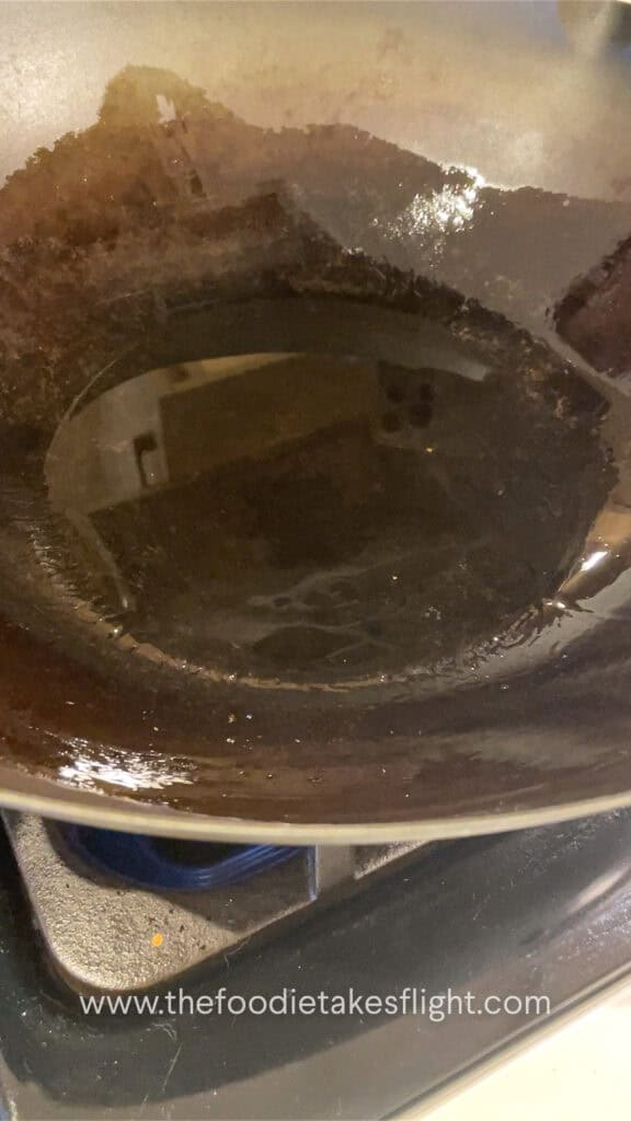 heating oil in wok