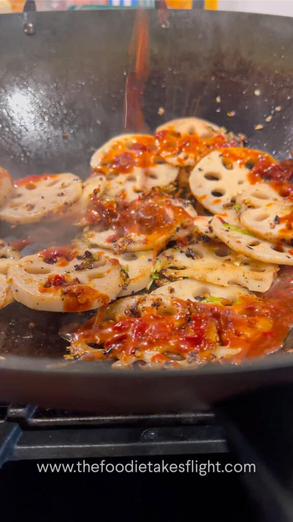 adding sauce to the lotus root