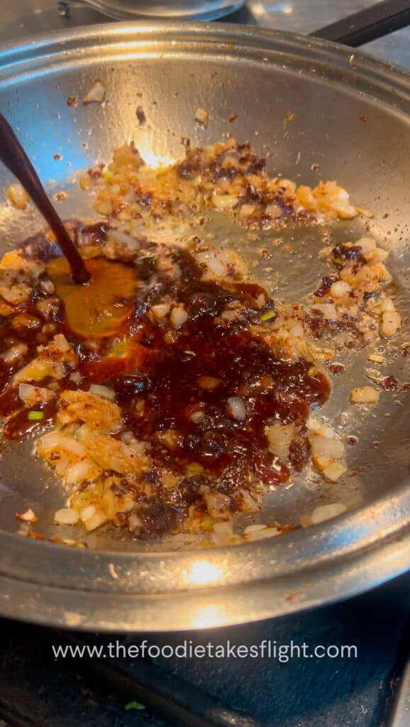 adding spicy black bean sauce