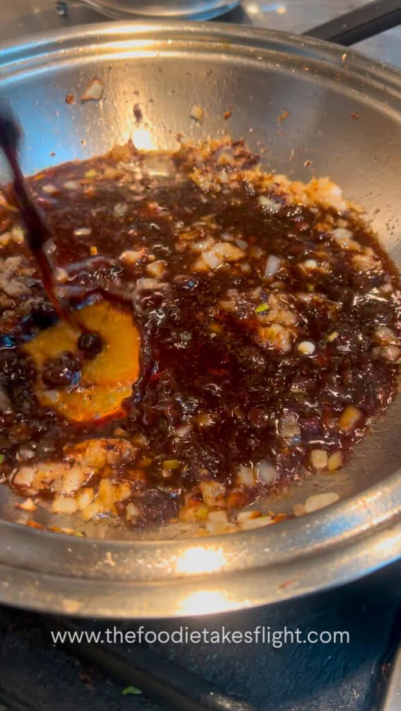 cooking minced tofu with spicy black bean sauce