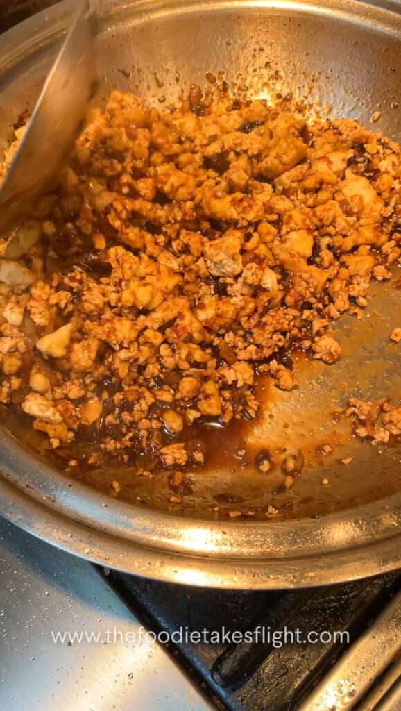 cooking minced tofu with spicy black bean sauce