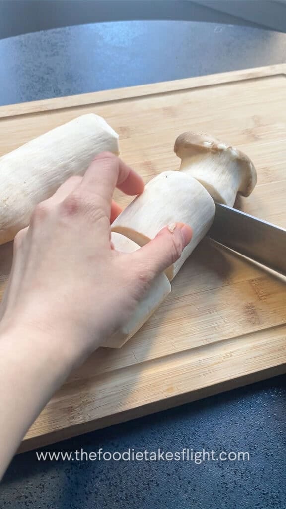 slicing king oyster mushrooms