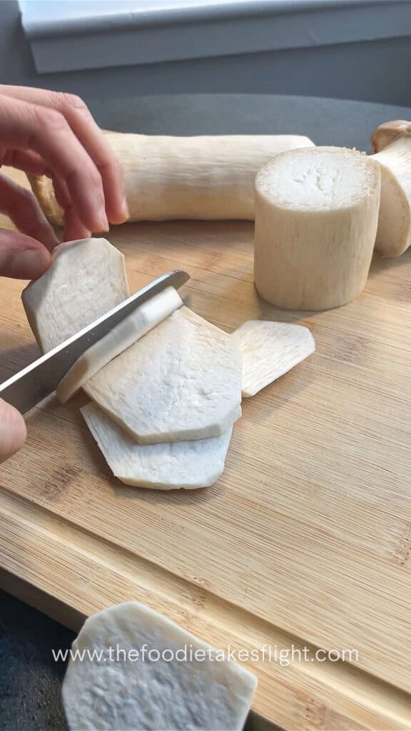 slicing king oyster mushrooms